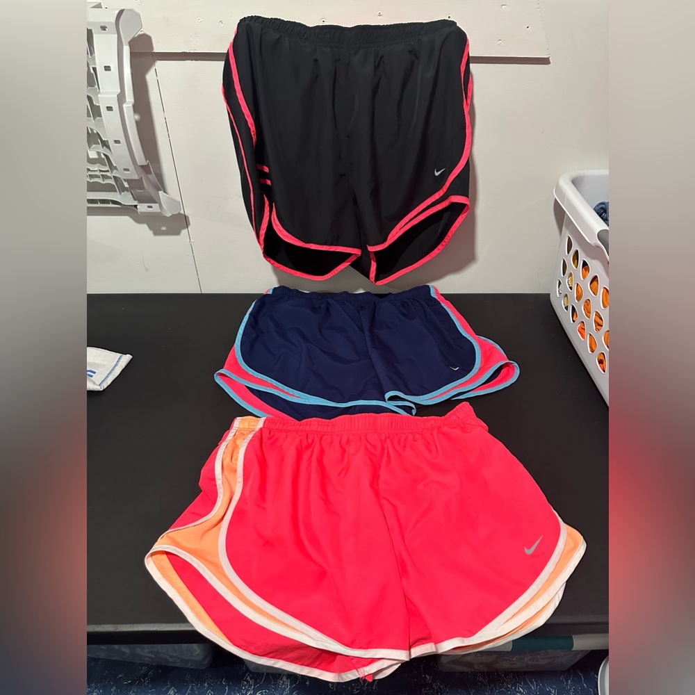 Women’s 3 pair of Nike running shorts.